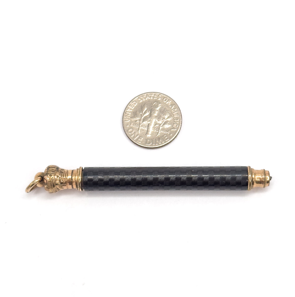 Shown horizontally below a dime for scale, the pencil is barely longer than four coin widths, its jump ring at left and the telescoping tip at the right-hand gold filled collar.