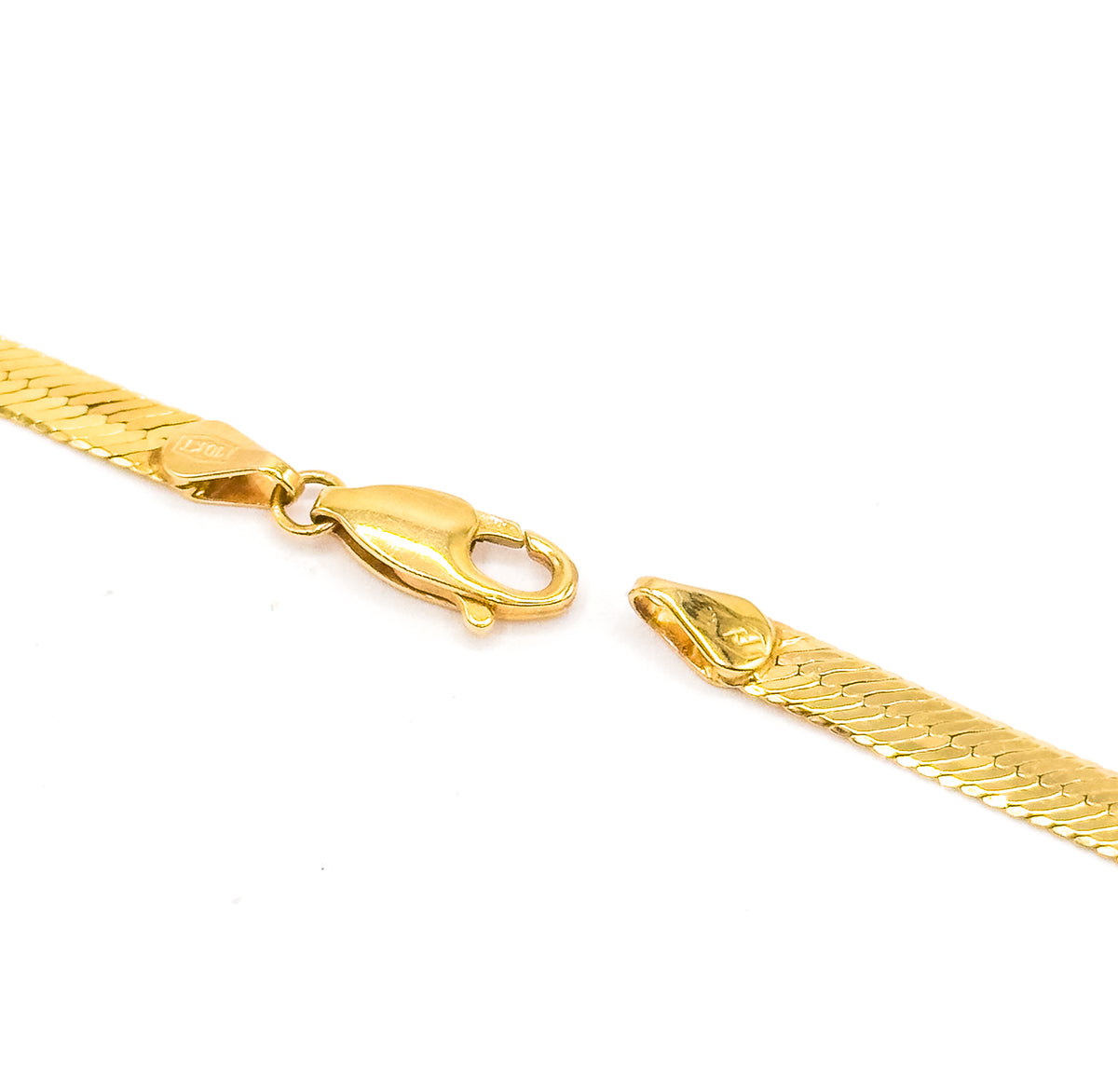 The open clasp end on white, the lobster clasp with its thumb lever swung on its hinge beside the separated ring fitting on the chain's other end.