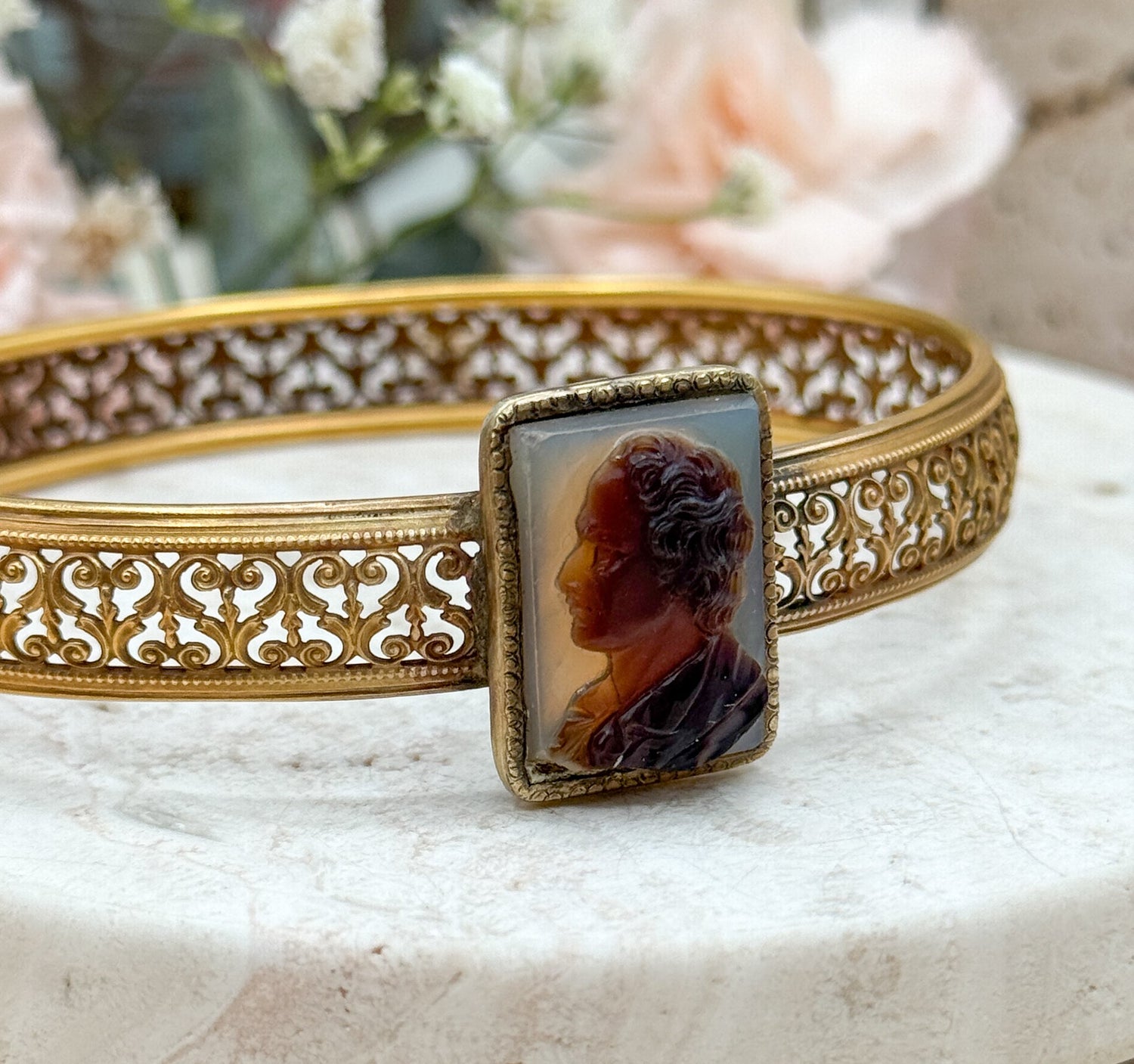 a filigree conversion bracelet with an antique cameo carved in hardstone gold