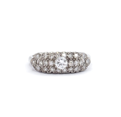 Overhead view against white showing the whole scalloped pavé face from above, the transitional cut centre diamond ringed by single cut diamonds with the platinum shank dropping away at each side.