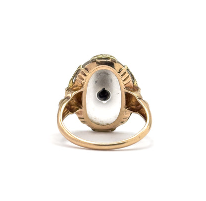 Almost the same view with slightly different angle, looking straight into the back of the setting where the flat underside of the cabochon shows the dark point of the diamond's setting at its centre.