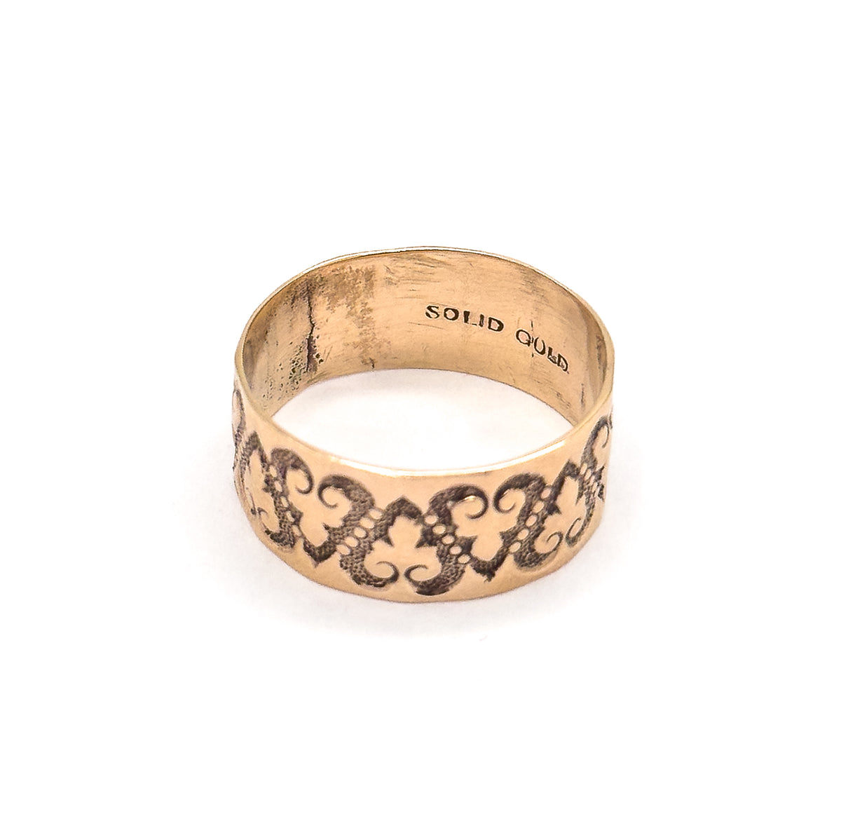 Standing with the interior tipped toward the viewer, the stamped words inside the shank now read the right way up above the row of raised hearts on the front of the band.