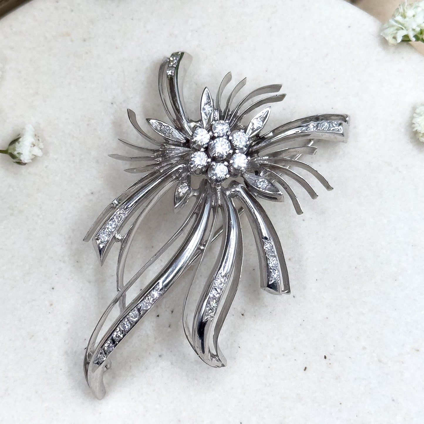18k white gold and diamond starburst brooch