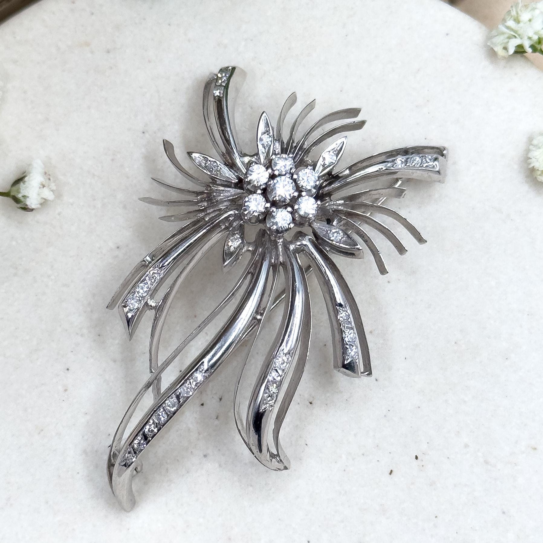 18k white gold and diamond starburst brooch