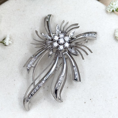 18k white gold and diamond starburst brooch