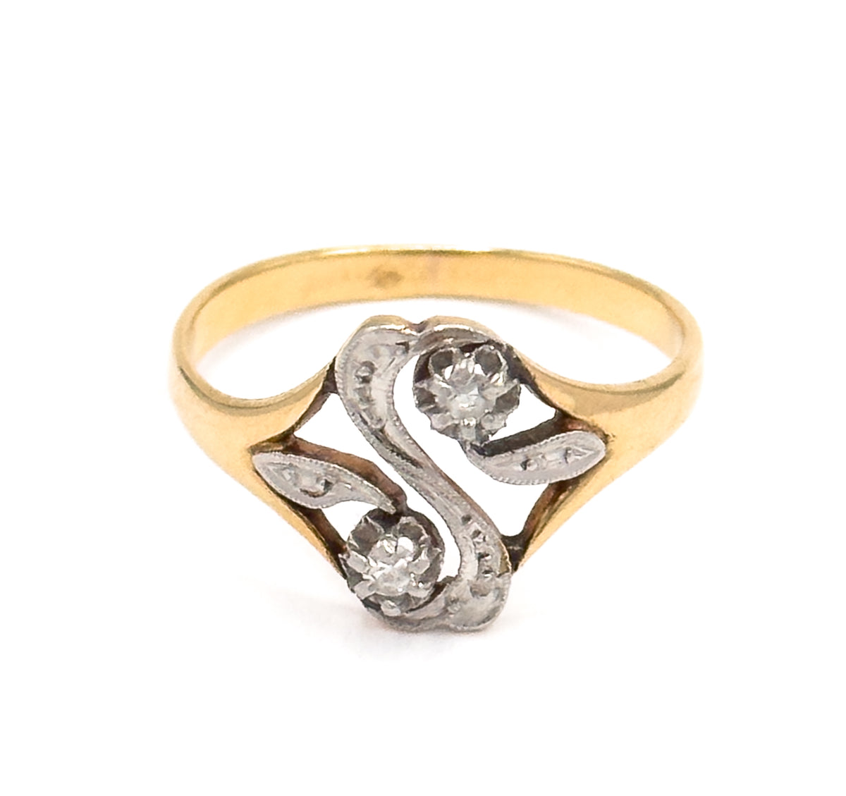 Head-on upright view against white, the full "S" face centred with its two prong-set diamonds set diagonally and milgrain-edged white gold curves flowing between the yellow gold shank.