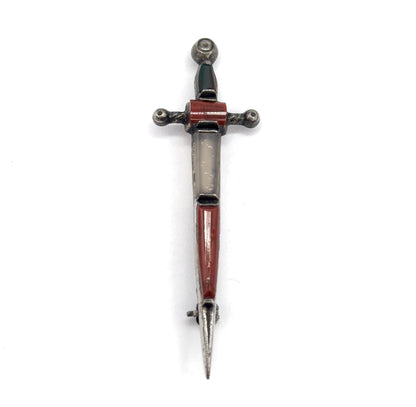 Straight-on front view with the sword upright and point down, showing the full length of stone-set blade, crossguard and pommel, with the pin stem and catch just visible near the tip.