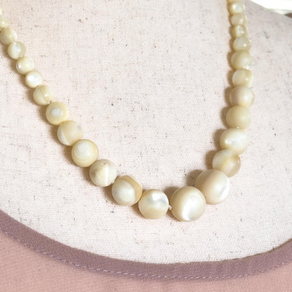 carved mother of pearl beaded necklace 
