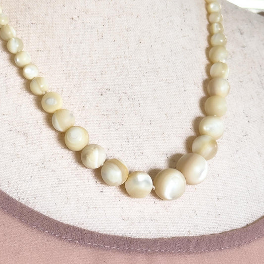 carved mother of pearl beaded necklace 

