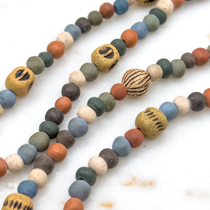 Colorful beaded necklaces on a white background