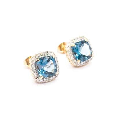 Contemporary Blue Topaz & Diamond Halo Stud Earrings in 14K Gold