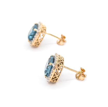 Contemporary Blue Topaz & Diamond Halo Stud Earrings in 14K Gold