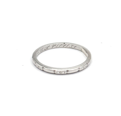 Tilted at a lower angle so the eye looks into the hoop, the cursive interior inscription reads clearly along the inner back while three etched geometric panels face forward on the outer shank.