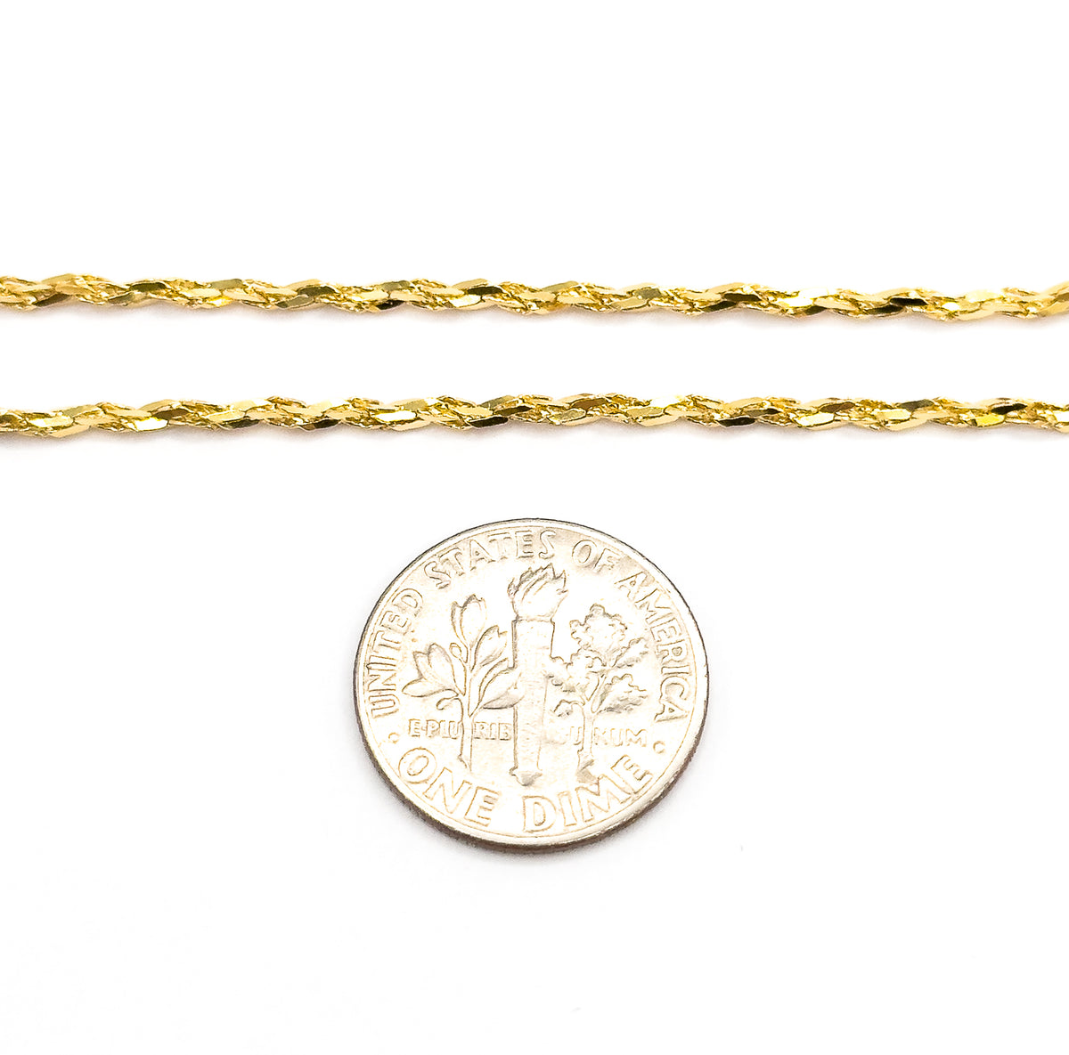 Two parallel runs of the 14K yellow gold crinkle chain laid flat on white beside a dime, showing the flat links are narrower than the coin's rim.