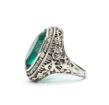Art Deco Green Glass Paste Ring with Pearl Halo & Bow Filigree Details in White Gold