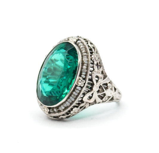 Art Deco Green Glass Paste Ring with Pearl Halo & Bow Filigree Details in White Gold