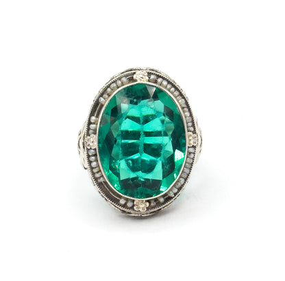 Art Deco Green Glass Paste Ring with Pearl Halo & Bow Filigree Details in White Gold