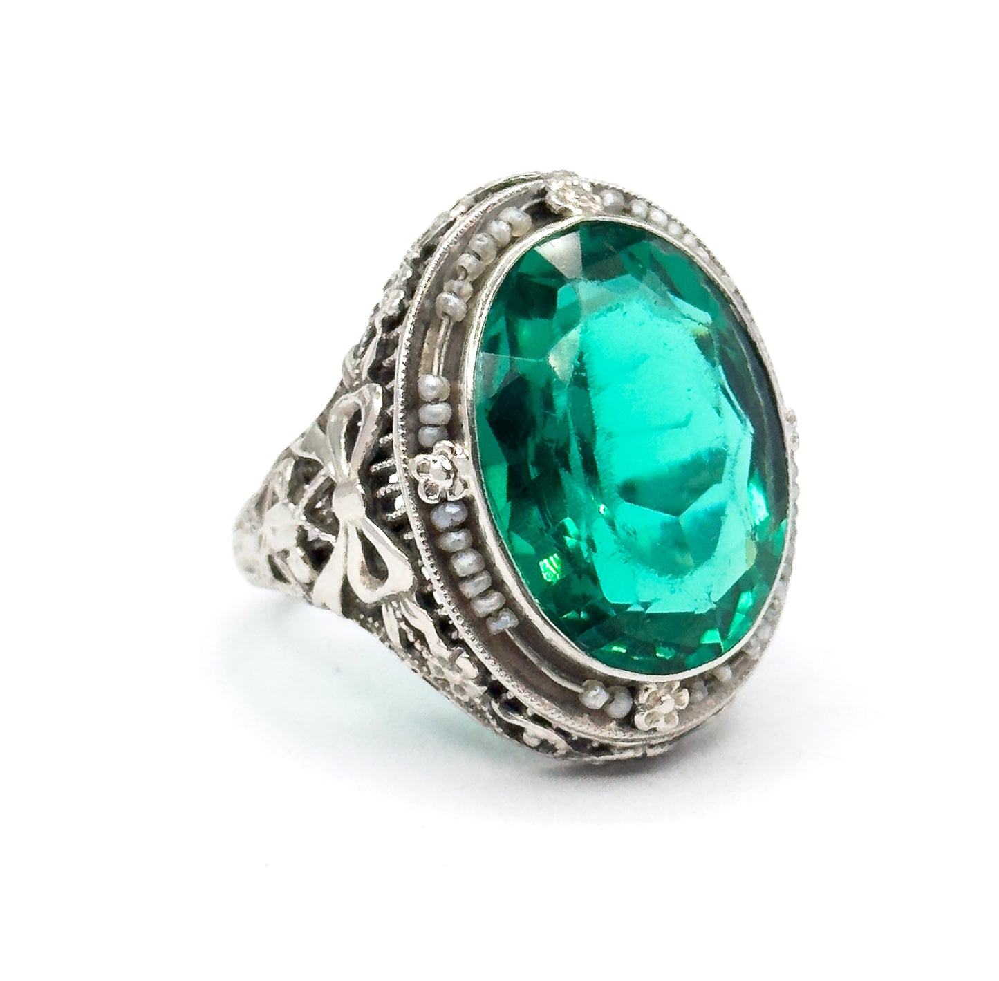 Art Deco Green Glass Paste Ring with Pearl Halo & Bow Filigree Details in White Gold