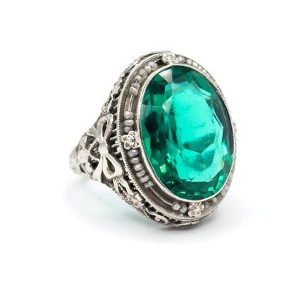 Art Deco Green Glass Paste Ring with Pearl Halo & Bow Filigree Details in White Gold