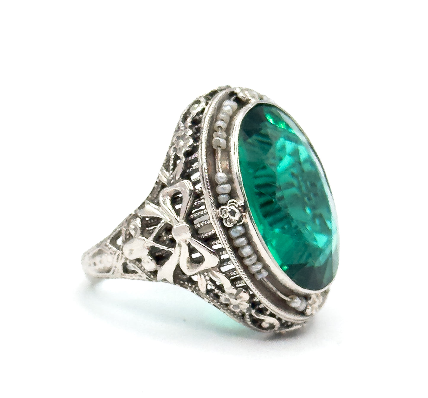 Art Deco Green Glass Paste Ring with Pearl Halo & Bow Filigree Details in White Gold