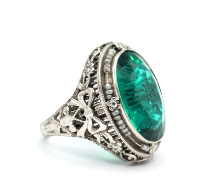 Art Deco Green Glass Paste Ring with Pearl Halo & Bow Filigree Details in White Gold