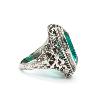 Art Deco Green Glass Paste Ring with Pearl Halo & Bow Filigree Details in White Gold