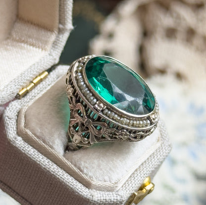 Art Deco Green Glass Paste Ring with Pearl Halo & Bow Filigree Details in White Gold