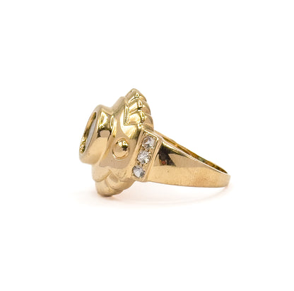 Full side profile from the opposite side, showing the scalloped edge of the face, a small round gold bead on the shoulder and three prong-set white sapphires above the tapering shank.