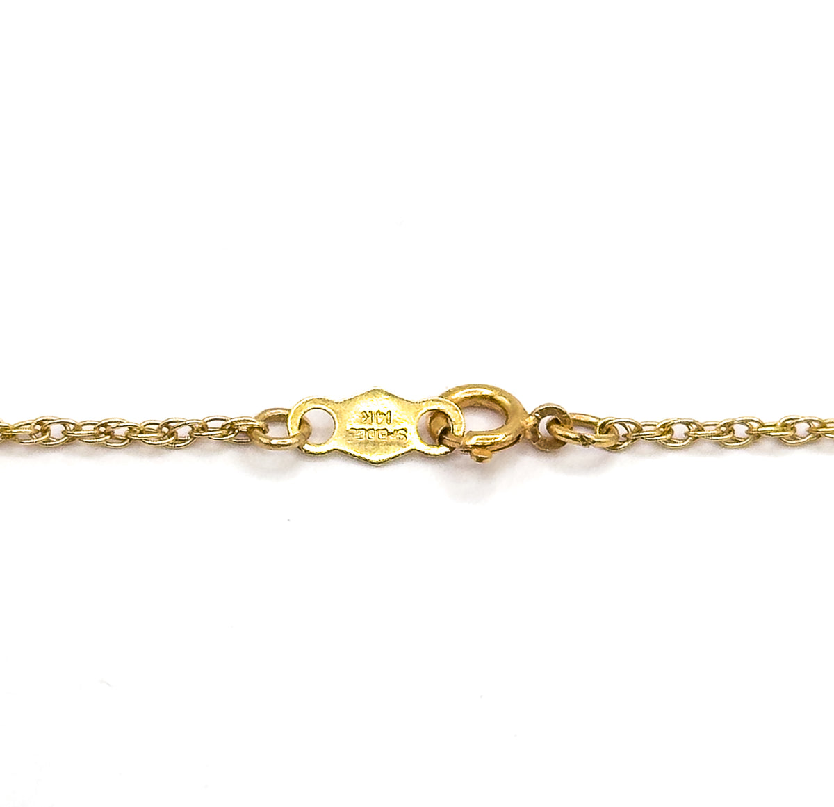 Close view of the chain's clasp on a white ground, the spring ring beside a small hexagonal tag stamped with a maker's mark, the fine twisted links running off to each side.
