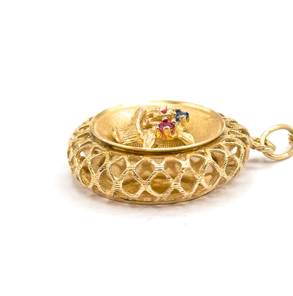 Low side-on close-up where the openwork lattice fills the frame and the textured basket tilts away, the three tiny red and blue stones just visible among the flowers, the bail ring at right.