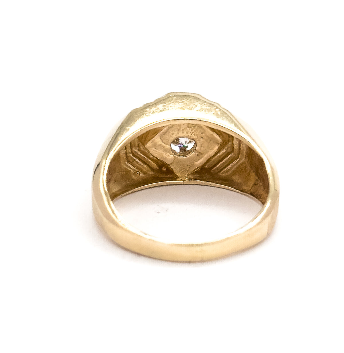 Looking straight through the open shank from below, the diamond glints in its prong setting at the centre of the face while the inner band and grooved underside frame it.
