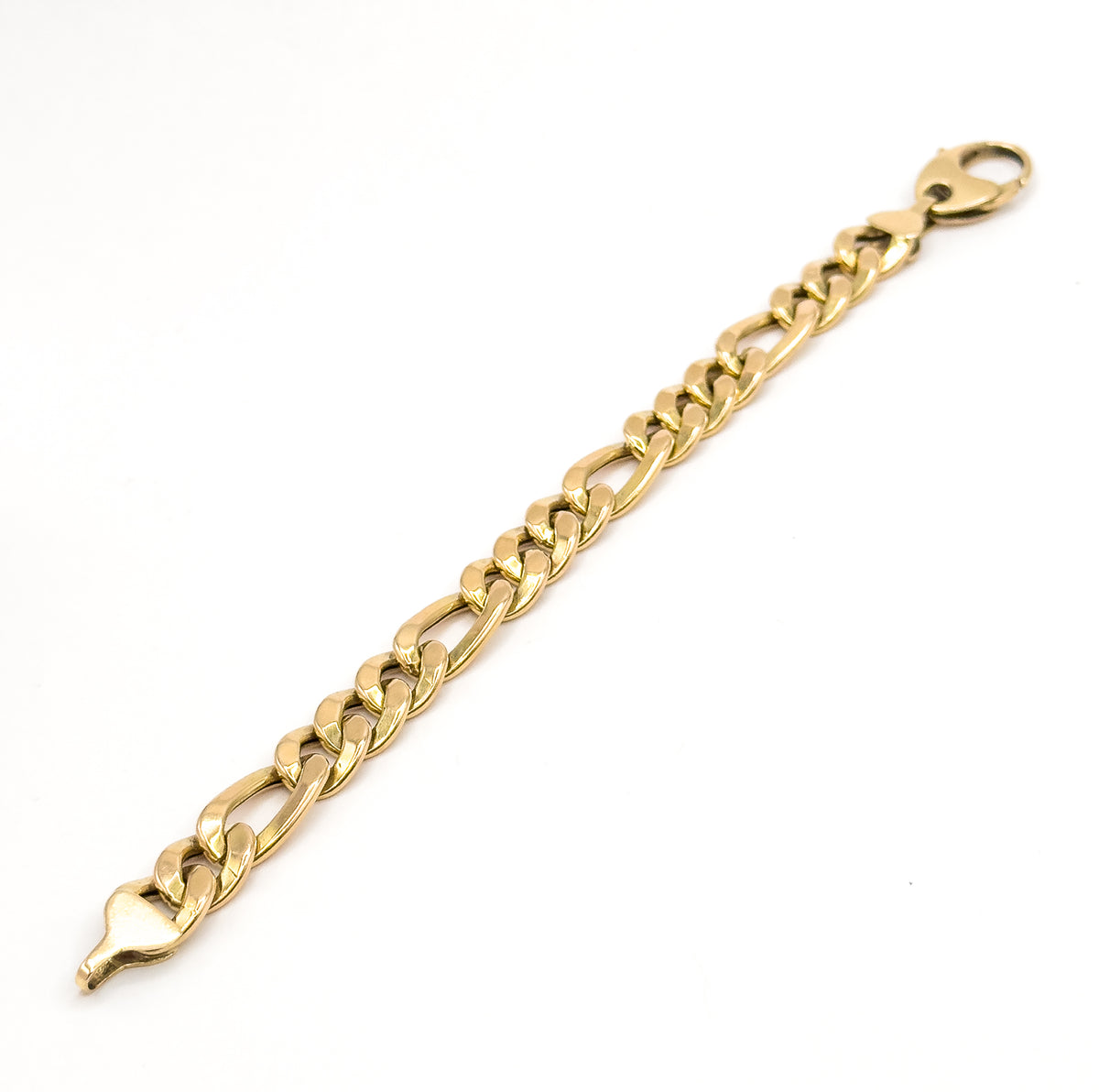 The full bracelet laid out flat on white, running corner to corner with the jumbo lobster clasp at the top end and the tapered tongue of the clasp fitting at the other.