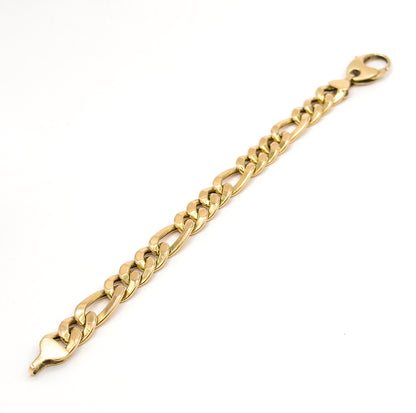 The full bracelet laid out flat on white, running corner to corner with the jumbo lobster clasp at the top end and the tapered tongue of the clasp fitting at the other.