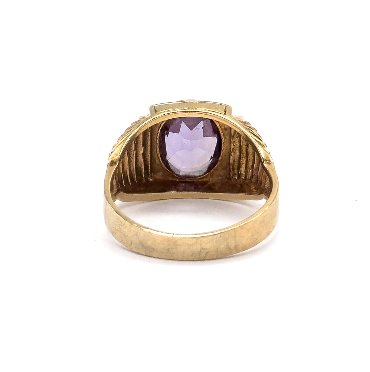 Almost the same view with slightly different angle, looking straight through the open shank at the bezel's back, the sapphire pale violet inside its frame above the broad inner band.