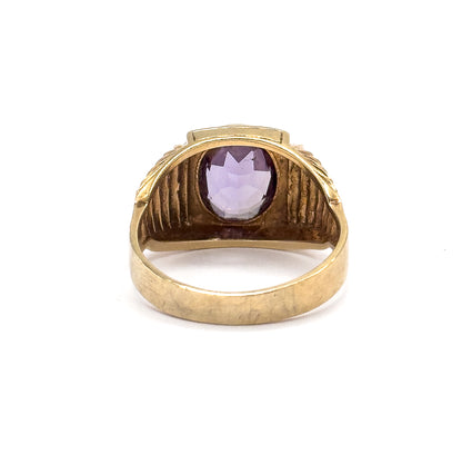 Almost the same view with slightly different angle, looking straight through the open shank at the bezel's back, the sapphire pale violet inside its frame above the broad inner band.