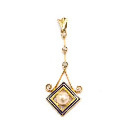 Straight-on upright view on white, the fluted bail at top and the three seed pearls spaced down the slender bar to the cobalt enamel square framing the creamy pearl.
