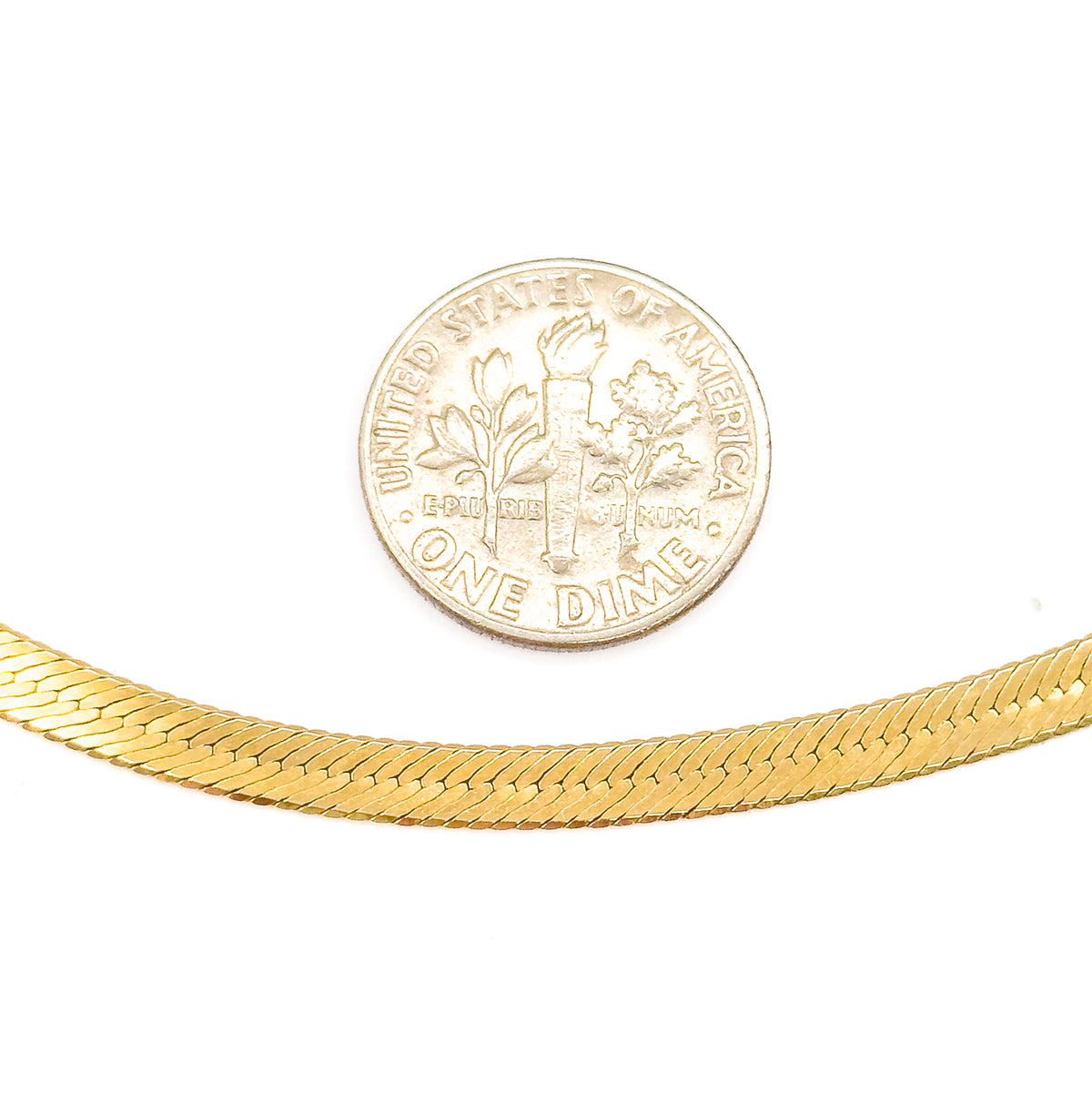 A gently curving length of the 10 karat yellow gold herringbone chain beneath a US dime on white, the coin giving a clear sense of the flat weave's narrow width.