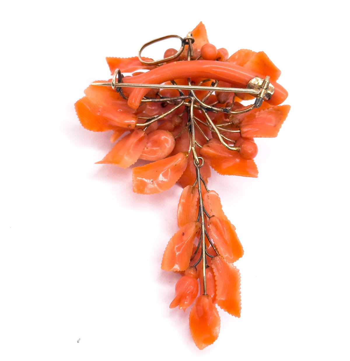 The back again with the pin stem closed across into its catch and the bail loop standing up at the top left, the gold branch wires fanning out and the coral tail hanging straight down.