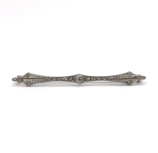 Full-length front view on plain white, the whole bar horizontal and centred so both diamond-shaped points and the pin stem and catch behind the left end are visible together.