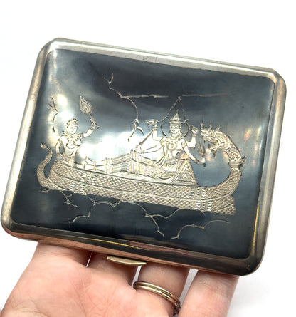 Held flat on an open palm so its size fills the hand, the whole rectangular case is in view with rounded corners and a small clasp thumbpiece at the lower edge.