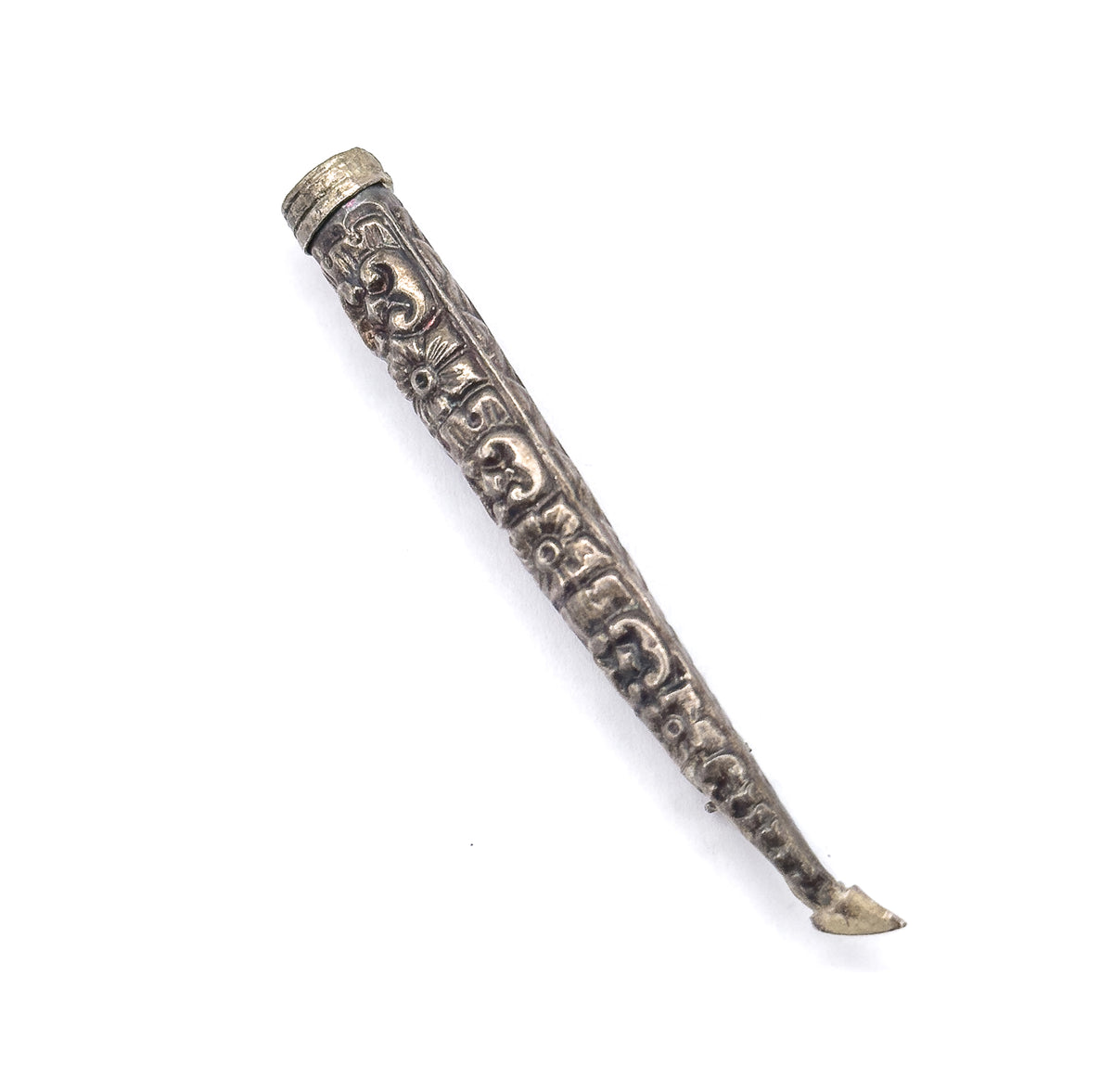 The cone shown alone on white without flowers, its collared rim at top and scrolled repoussé running the full taper to the pin stem, which curves slightly at the lower tip.