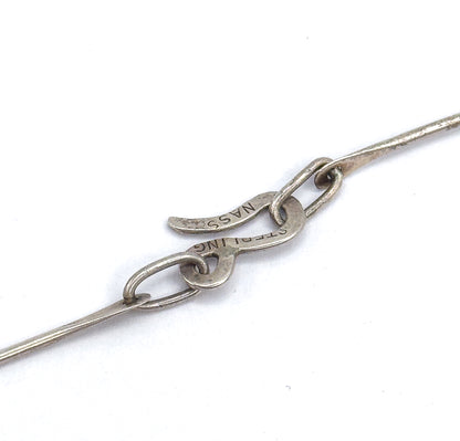 Mid-century red glass atomic necklace and earring set in sterling silver, shown here as a close-up of the necklace's hook-and-loop clasp on white, with "STERLING" and "NASS" stamps visible.