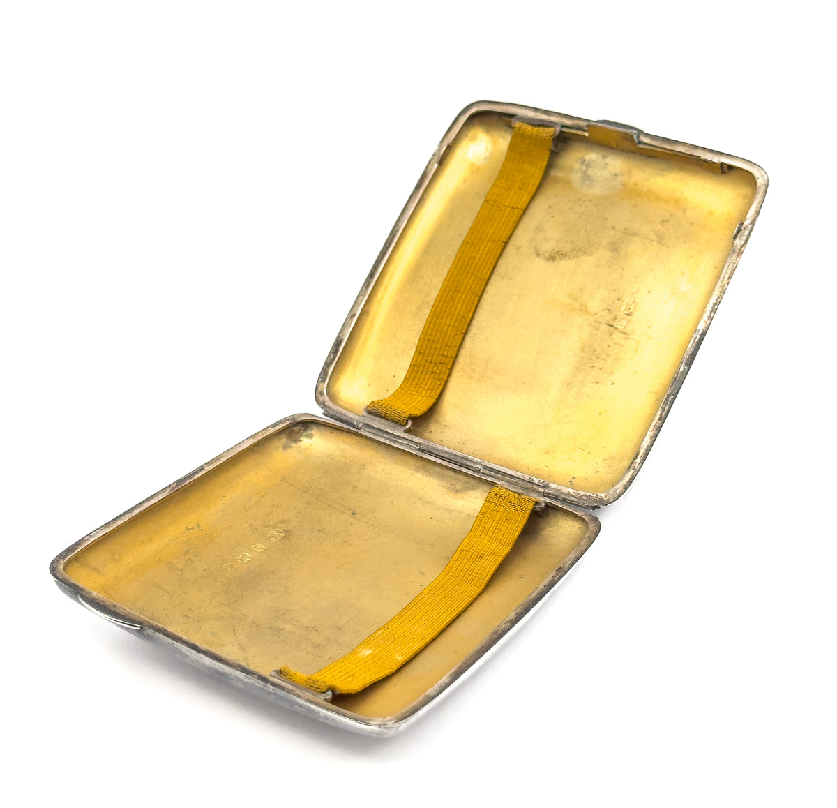 The case opened out flat, both gilt halves and both yellow straps in frame, with the hinge running across the centre.