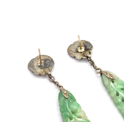 Almost the same view with slightly different angle, cropped closer on the scalloped backs of the two tops so the bare posts, small backs and the chain links meeting the jade drop tips fill the frame.