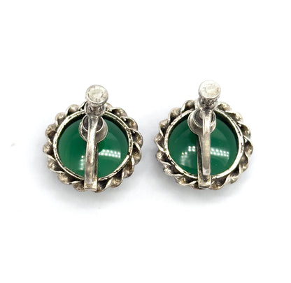 Reverse view of the pair, the screw-back bars and round screw heads crossing each green cabochon inside its cable-textured sterling silver frame.