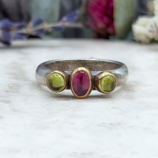 Garnet and peridot ring in gold and silver handmade w bezel