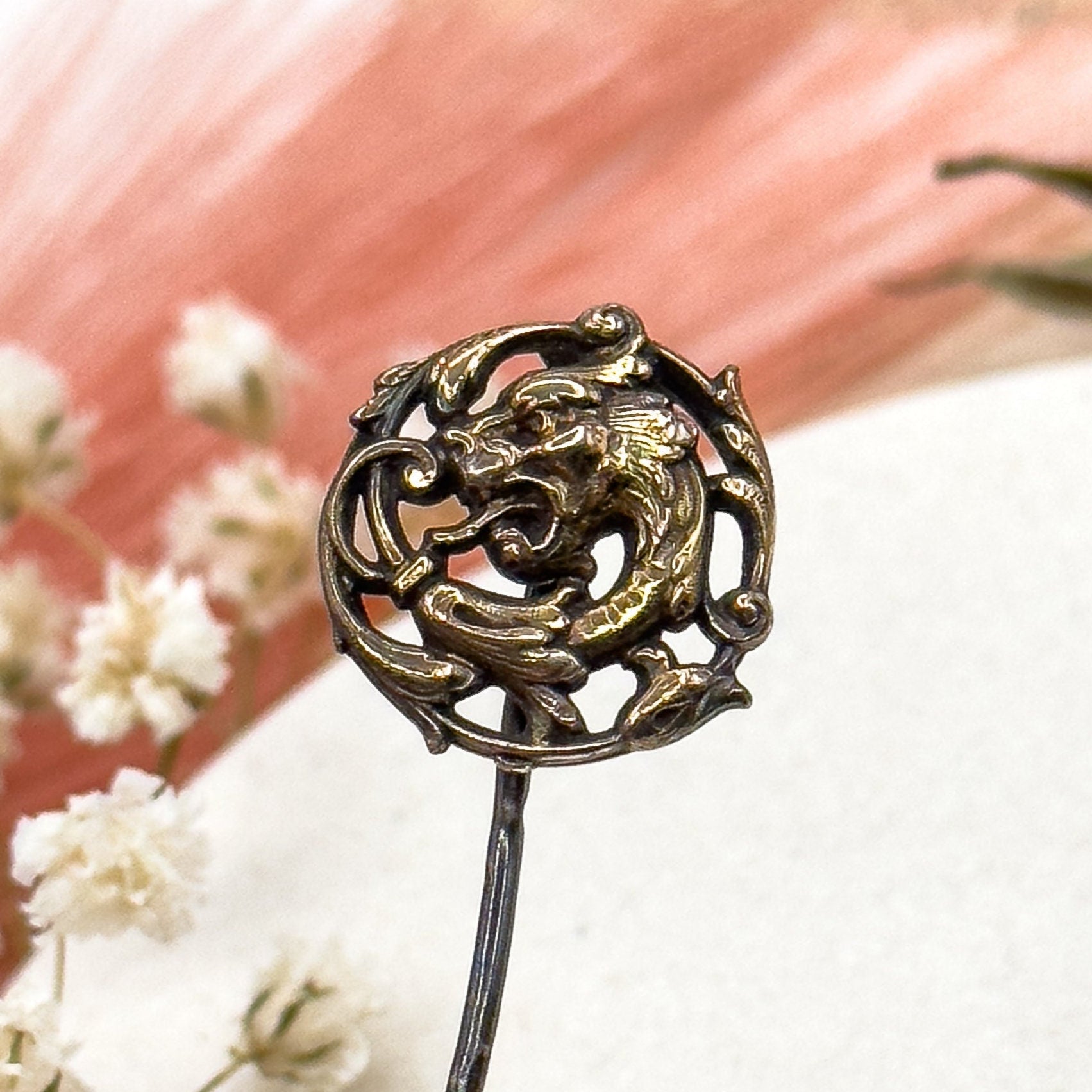 Decorative hairpin with dragon design on a soft background