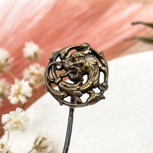 Decorative hairpin with dragon design on a soft background