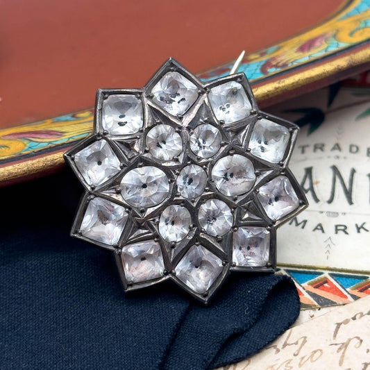 georgian era brooch with black dots

