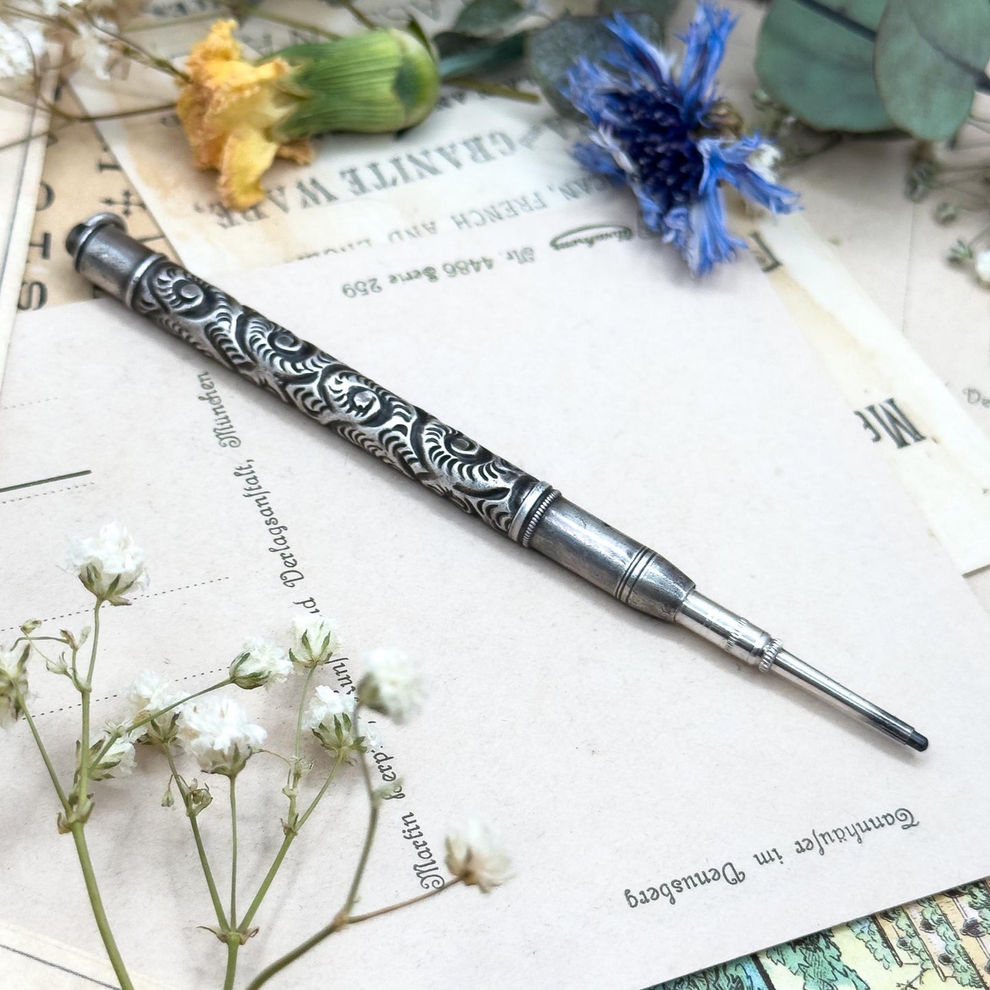 Decorative pen on vintage paper with flowers